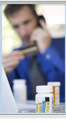 A photo of a guy getting his prescription refilled.